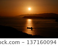 Sunset over the sea and illuminated boat 137160094
