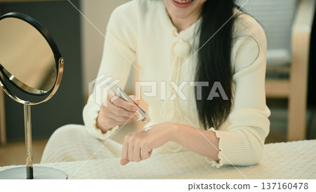 Closeup woman applying body cream moisturizing lotion, routine in the morning 137160478