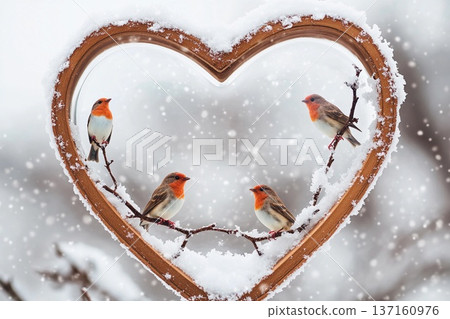 Heart-shaped snow globe showcases two vibrant birds in a winter wonderland setting 137160976