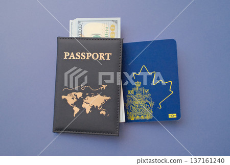 Canadian passport with US dollar banknotes in leather cover on gray background, travel and immigration finance concept Canadian passport with US dollar banknotes in leather cover on gray background, travel and immigration finance concept 137161240