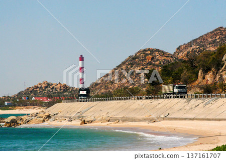 Beautiful Landscape With A Coastal Road And Rock Mountain In Binh Thuan Province, Vietnam. Beautiful Landscape With A Coastal Road And Rock Mountain In Binh Thuan Province, Vietnam. 137161707