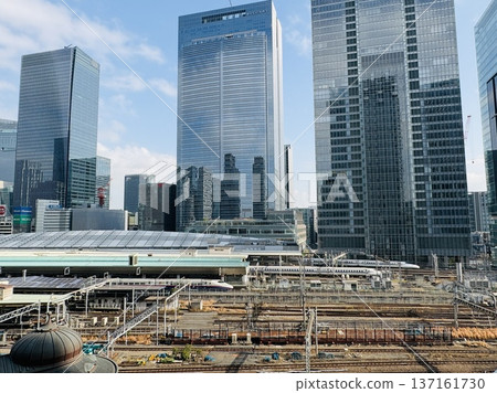 Tokyo Station seen from the Marunouchi River - Hokuriku Shinkansen Hakutaka and Tokaido Shinkansen Nozomi trains are shown together Tokyo Station seen from the Marunouchi River - Hokuriku Shinkansen Hakutaka and Tokaido Shinkansen Nozomi trains are shown together 137161730