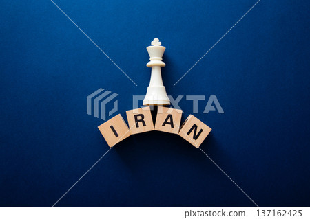 Chess king piece controlling iran wooden blocks 137162425