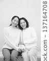 Monochrome portrait of a close mother and daughter Monochrome portrait of a close mother and daughter 137164708