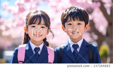 Cute first grade elementary school student with cherry blossom background Cute first grade elementary school student with cherry blossom background 137164883