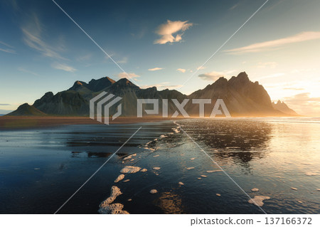 Sunrise over Vestrahorn mountain with ocean wave during summer at Stokksnes, Iceland 137166372