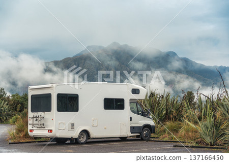 Campervan parked in parking area with misty mountain backdrop in New Zealand 137166450