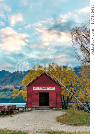 Scenic Glenorchy boat shed by Lake Wakatipu with colorful autumn foliage and mountain in New Zealand Scenic Glenorchy boat shed by Lake Wakatipu with colorful autumn foliage and mountain in New Zealand 137166453
