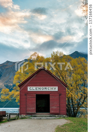 Scenic Glenorchy boat shed by Lake Wakatipu with colorful autumn foliage and mountain in New Zealand Scenic Glenorchy boat shed by Lake Wakatipu with colorful autumn foliage and mountain in New Zealand 137166456