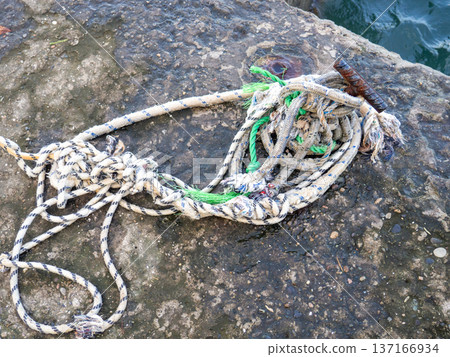 Place for attaching a small boat. Fittings for tying the mooring line. Mounting point. Small bollard on the pier. 137166934