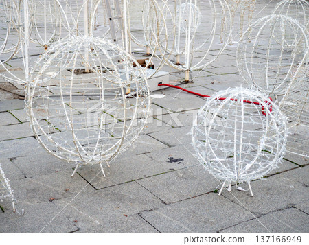 Installing New Year's decorations on the street. Festive figures for Christmas. 137166949