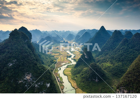 Phong Nam Valley with rice field and river flows through traditional village in countryside 137167120