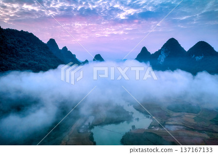Sunrise sky over mountain with foggy on winding river in countryside at Phong Nam Valley Sunrise sky over mountain with foggy on winding river in countryside at Phong Nam Valley 137167133