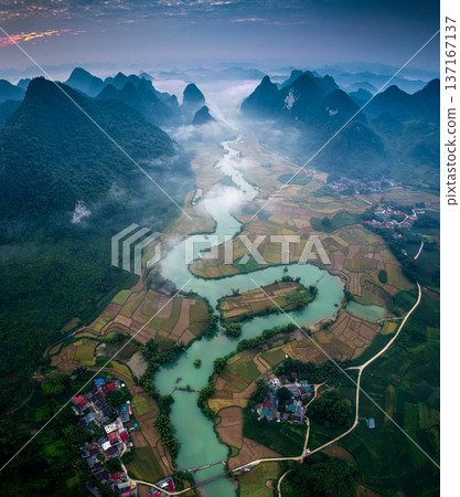 Majestic Phong Nam valley with winding river among the rice paddy field in rural village on the morning 137167137