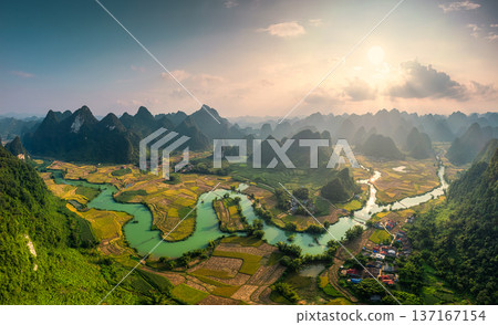 Phong Nam Valley with rice field and river flows through traditional village in countryside 137167154