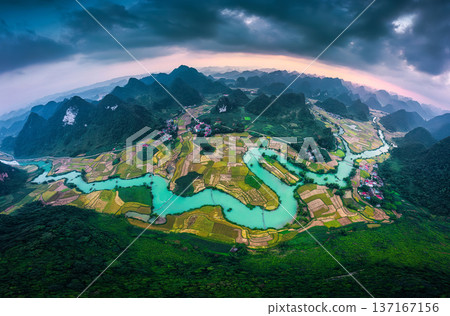 Phong Nam Valley with rice field and winding river through traditional village in countryside at Vietnam 137167156