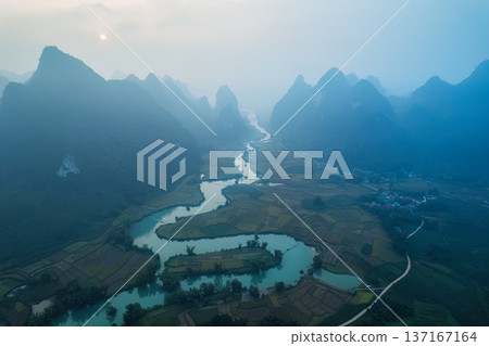Beautiful foggy mountain on rural village and winding river at Phong Nam Valley Beautiful foggy mountain on rural village and winding river at Phong Nam Valley 137167164