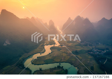 Golden sunrise over mountain range with winding river on agricultural village at Phong Nam Valley at Vietnam 137167166
