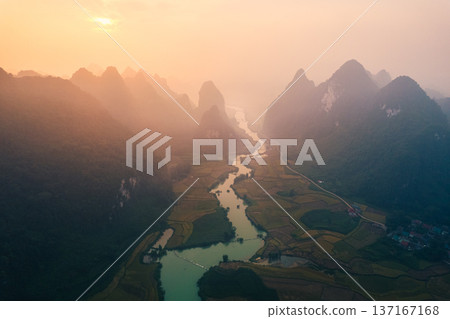 Sunrise over mountain range in foggy on winding river at Phong Nam Valley Sunrise over mountain range in foggy on winding river at Phong Nam Valley 137167168