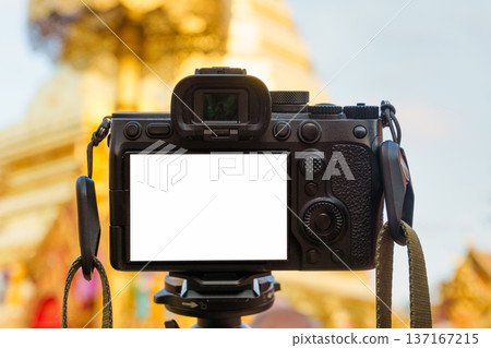 Mirrorless digital camera on tripod capturing golden temple Mirrorless digital camera on tripod capturing golden temple 137167215