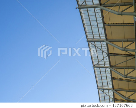 vault of a modern football stadium. Canopy of the sports arena. Metal construction. vault of a modern football stadium. Canopy of the sports arena. Metal construction. 137167663