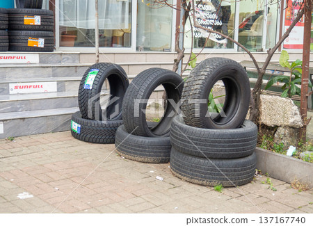 Shop selling car tires. Spare parts sales business. Rubber tires. The concept of changing tires. Shop selling car tires. Spare parts sales business. Rubber tires. The concept of changing tires. 137167740