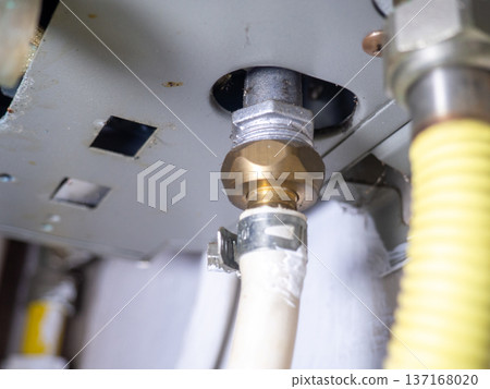 Part of gas equipment. Hoses in a gas water heater. Gas flows through these pipes at home. Part of gas equipment. Hoses in a gas water heater. Gas flows through these pipes at home. 137168020