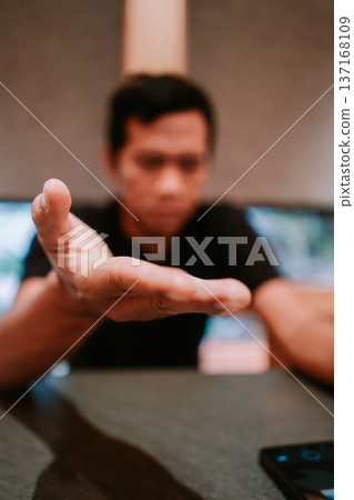 Man's Open Hand Reaching Out for Help and Connection Man's Open Hand Reaching Out for Help and Connection 137168109