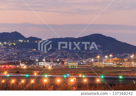 Osaka International Airport (Itami Airport) runway and aircraft evening view 137168242