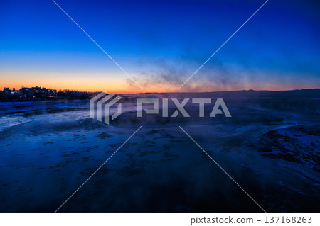 A fantastical scene of morning mist rising over the Tokachi River in winter and ice blocks resembling drifting ice A fantastical scene of morning mist rising over the Tokachi River in winter and ice blocks resembling drifting ice 137168263