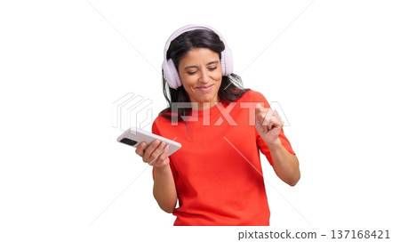 Woman dancing with headphones holding smartphone listening music Woman dancing with headphones holding smartphone listening music 137168421
