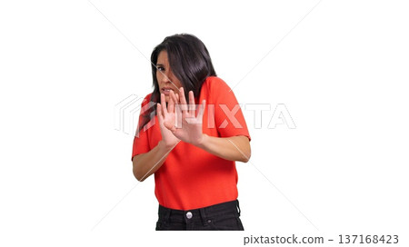 Scared woman expressing fear with defensive stop gesture 137168423