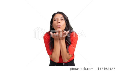 Woman blowing a kiss expressing love and affection Woman blowing a kiss expressing love and affection 137168427
