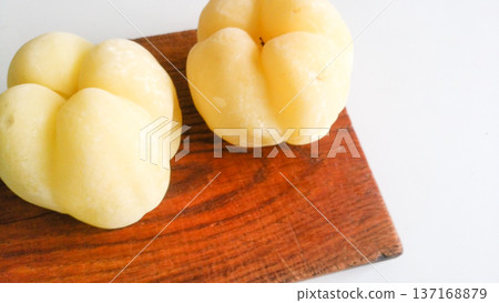 Chaenomeles japonica frozen on a wooden board. Chaenomeles japonica frozen on a wooden board. 137168879