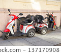 Three-wheeled electric mopeds. Comfortable moped for the city. Compact vehicle 137170908