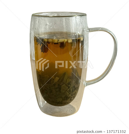 Green tea brewing in a double walled glass mug Green tea brewing in a double walled glass mug 137171332