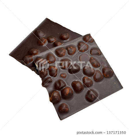 Broken dark chocolate bar with roasted hazelnuts Broken dark chocolate bar with roasted hazelnuts 137171350
