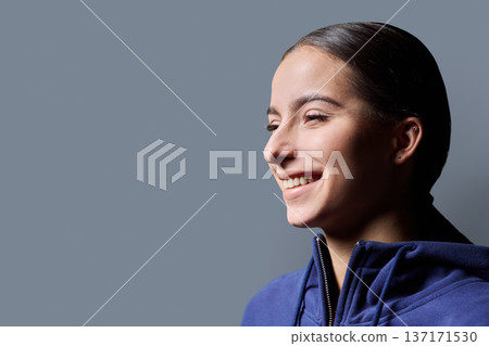 Profile headshot portrait of young happy woman on gray background 137171530