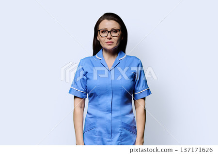 Portrait of mature woman nurse on white studio background Portrait of mature woman nurse on white studio background 137171626