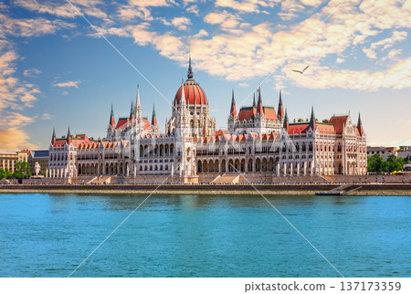Wonderful sunset view of Hungarian Parliament building and Danube river in Budapest, Hungary Wonderful sunset view of Hungarian Parliament building and Danube river in Budapest, Hungary 137173359