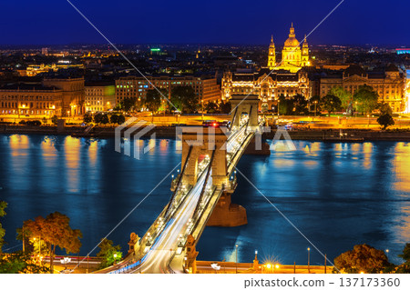 Aerial night view of Budapest with Chain Bridge and Saint Stephen Basilica, Hungary Aerial night view of Budapest with Chain Bridge and Saint Stephen Basilica, Hungary 137173360