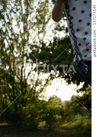 Happy child showing toy duck while standing in store with blurred price tags Happy child showing toy duck while standing in store with blurred price tags 137173545