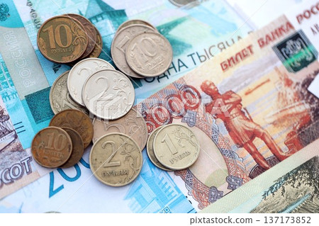 Coins and banknotes of Russian Federation ruble currency. Russia RUB money close up. Business, economy and finance concept Coins and banknotes of Russian Federation ruble currency. Russia RUB money close up. Business, economy and finance concept 137173852