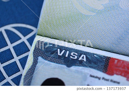 Detail of US visa applied on passport. United States visa header in passport page close up Detail of US visa applied on passport. United States visa header in passport page close up 137173937