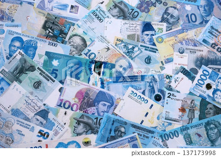 Various currencies money bills banknotes in full frame. Many cash bills from different countries in big pile close up. World economy and currency exchange concept 137173998