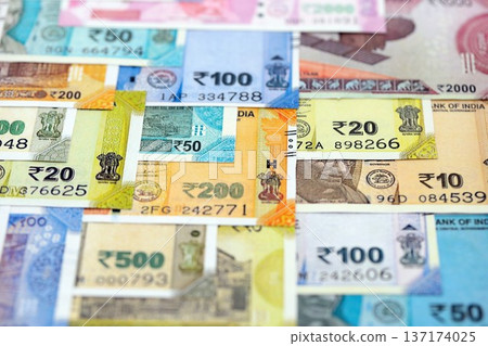 Big pile of Indian Rupees money bills banknotes close up. Lots of money of Indian INR currency cash in big bunch. Economics and business in India Big pile of Indian Rupees money bills banknotes close up. Lots of money of Indian INR currency cash in big bunch. Economics and business in India 137174025