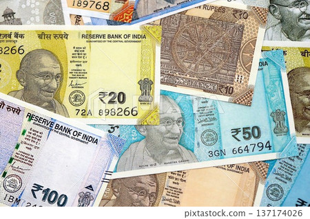 Big pile of Indian Rupees money bills banknotes close up. Lots of money of Indian INR currency cash in big bunch. Economics and business in India Big pile of Indian Rupees money bills banknotes close up. Lots of money of Indian INR currency cash in big bunch. Economics and business in India 137174026