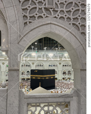 Pilgrims performing tawaf around the Kaaba at Masjid al-Haram in Mecca during pilgrimage Pilgrims performing tawaf around the Kaaba at Masjid al-Haram in Mecca during pilgrimage 137174079