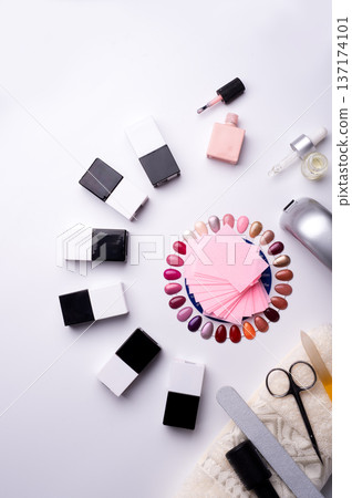 set for manicure with gell polish  bottles, LED lamp and accessoires on white background. flat lay 137174101