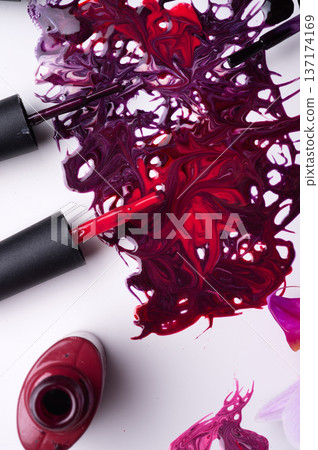 beautiful colorful abstract nail gel polish texture with applicators and orchid on white background beautiful colorful abstract nail gel polish texture with applicators and orchid on white background 137174169